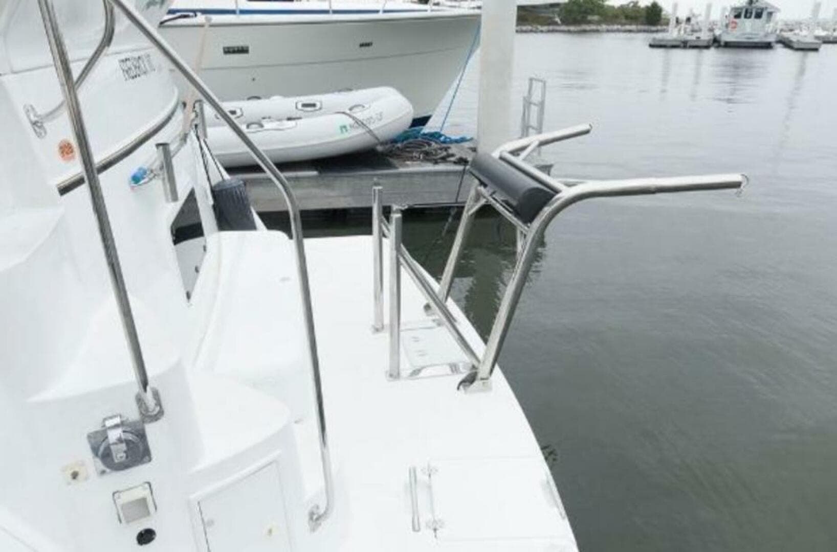 2000 Carver 506 Motor Yacht docked with swim platform and railing.
