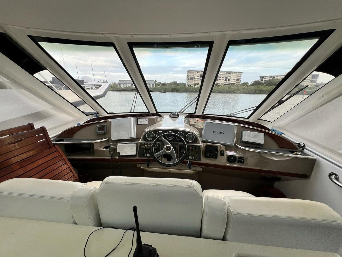 Interior view of 2000 Carver 506 Motor Yacht helm with navigation equipment and panoramic windows.