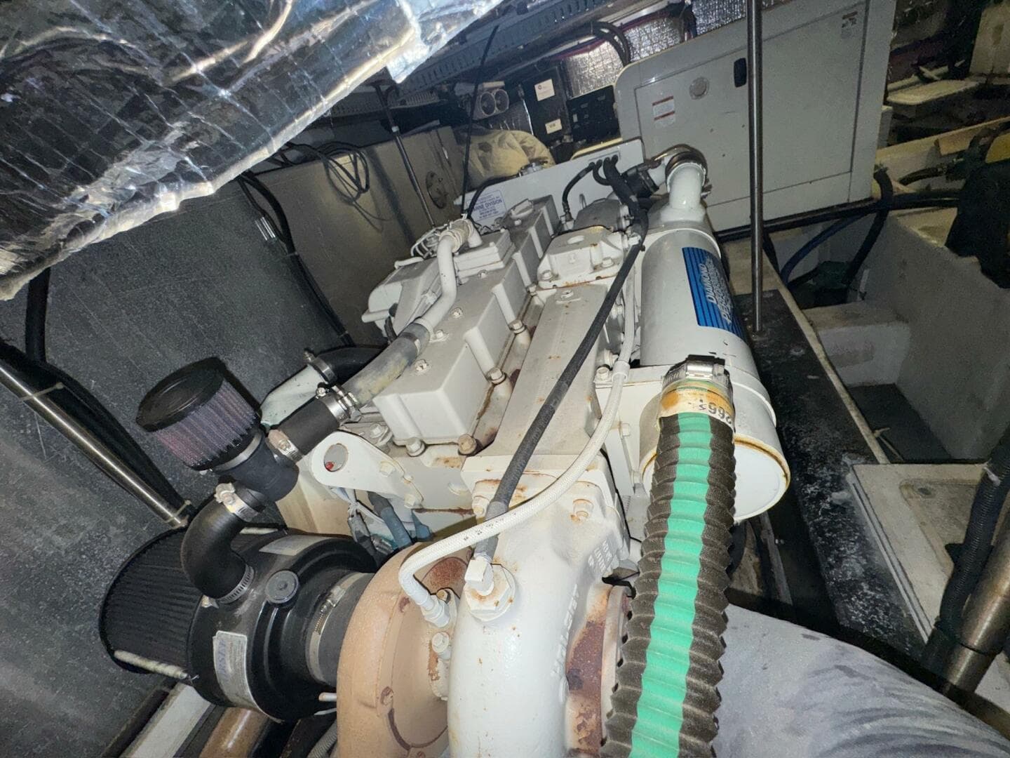 Engine room of 2000 Carver 506 Motor Yacht, showcasing mechanical components and systems.