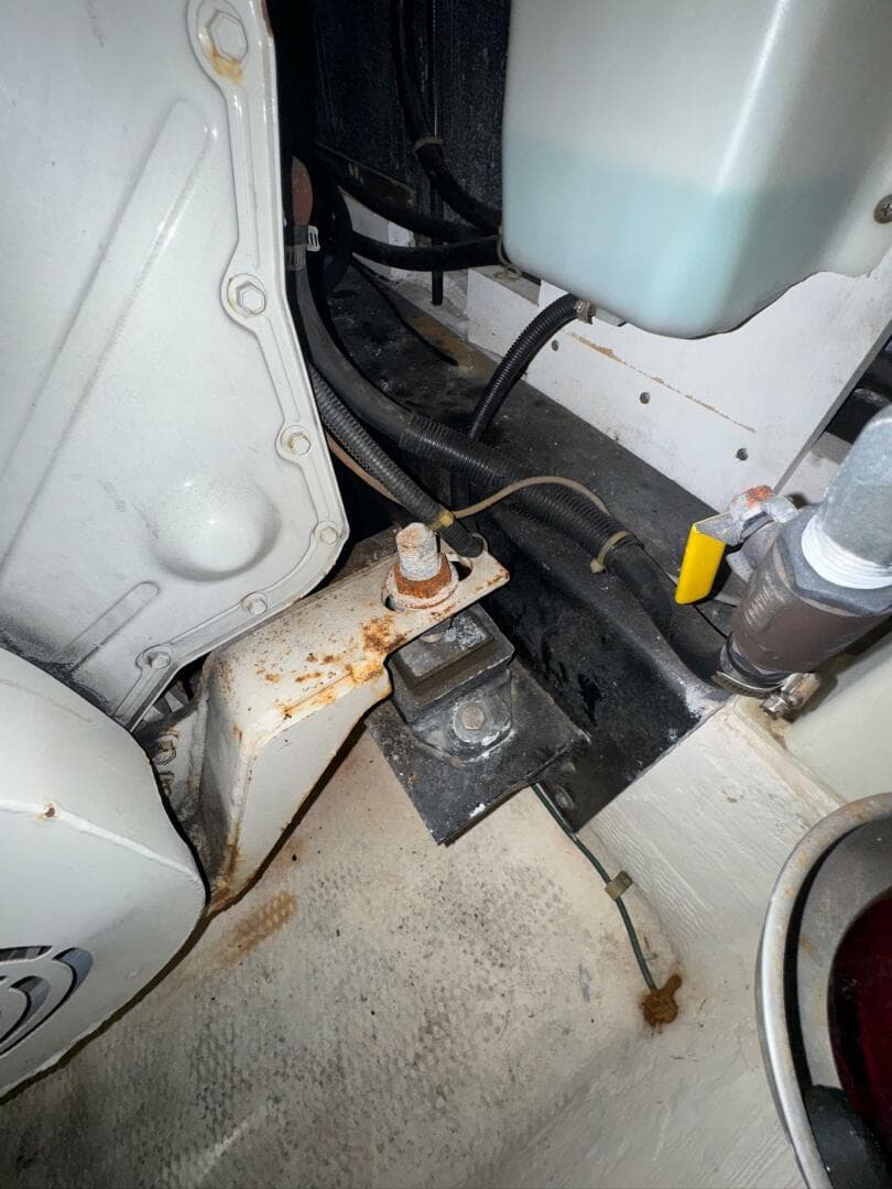 Engine compartment of a 2000 Carver 506 Motor Yacht, showing mechanical components and wiring.