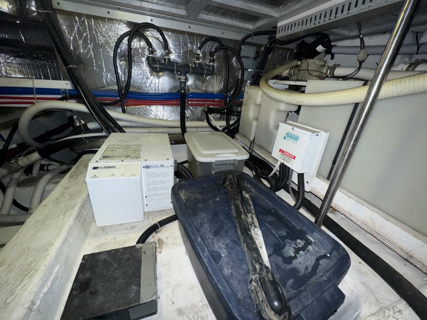 Engine room of 2000 Carver 506 Motor Yacht with various equipment and wiring.