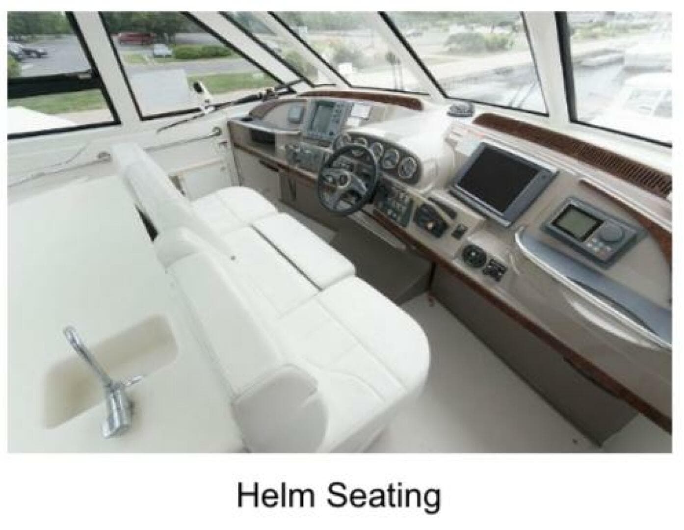 Helm seating area of 2000 Carver 506 Motor Yacht with modern controls and navigation displays.