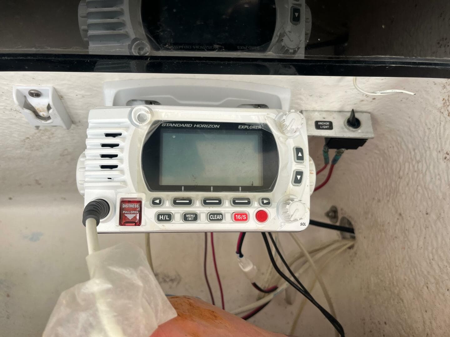 VHF marine radio on 1998 Blue Fin 25 Center Console boat dashboard.