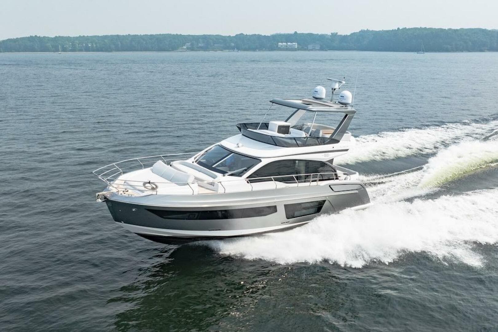 2023 Azimut Fly 53 yacht cruising on open water, showcasing sleek design and luxury features.