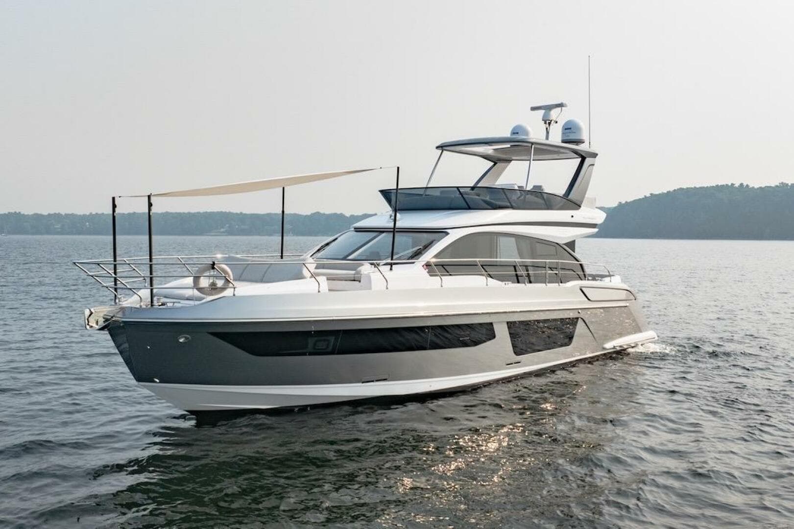 2023 Azimut Fly 53 yacht cruising on calm waters.