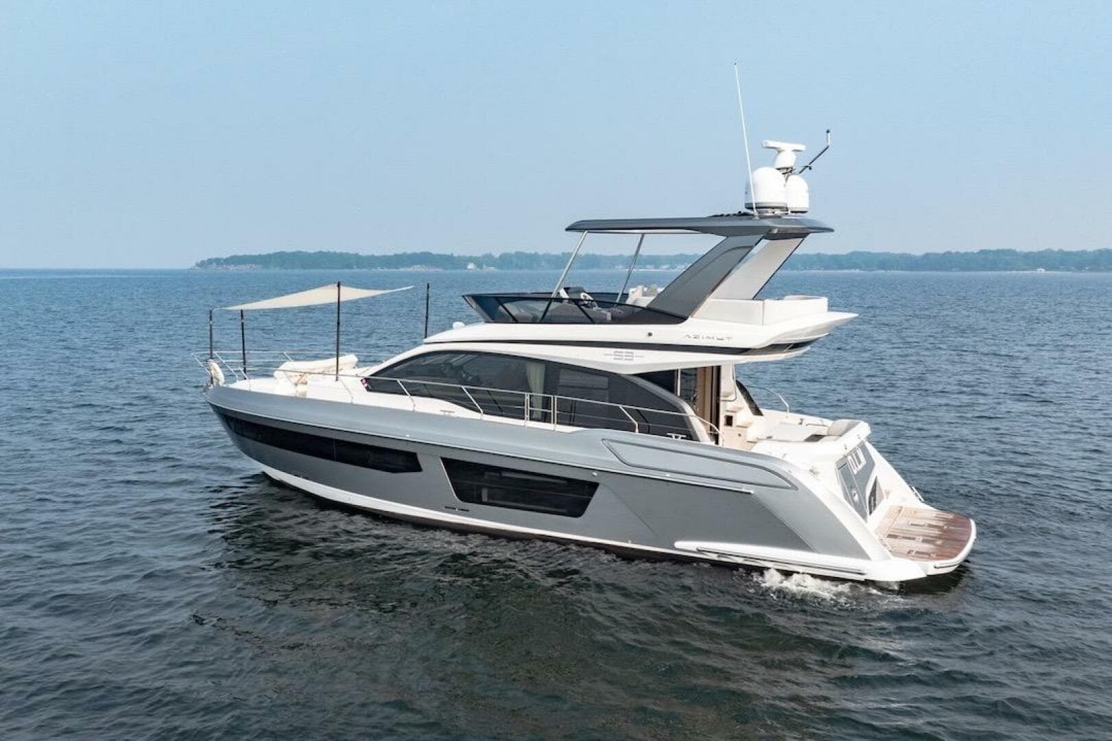 2023 Azimut Fly 53 yacht cruising on open water, showcasing sleek design and luxury features.