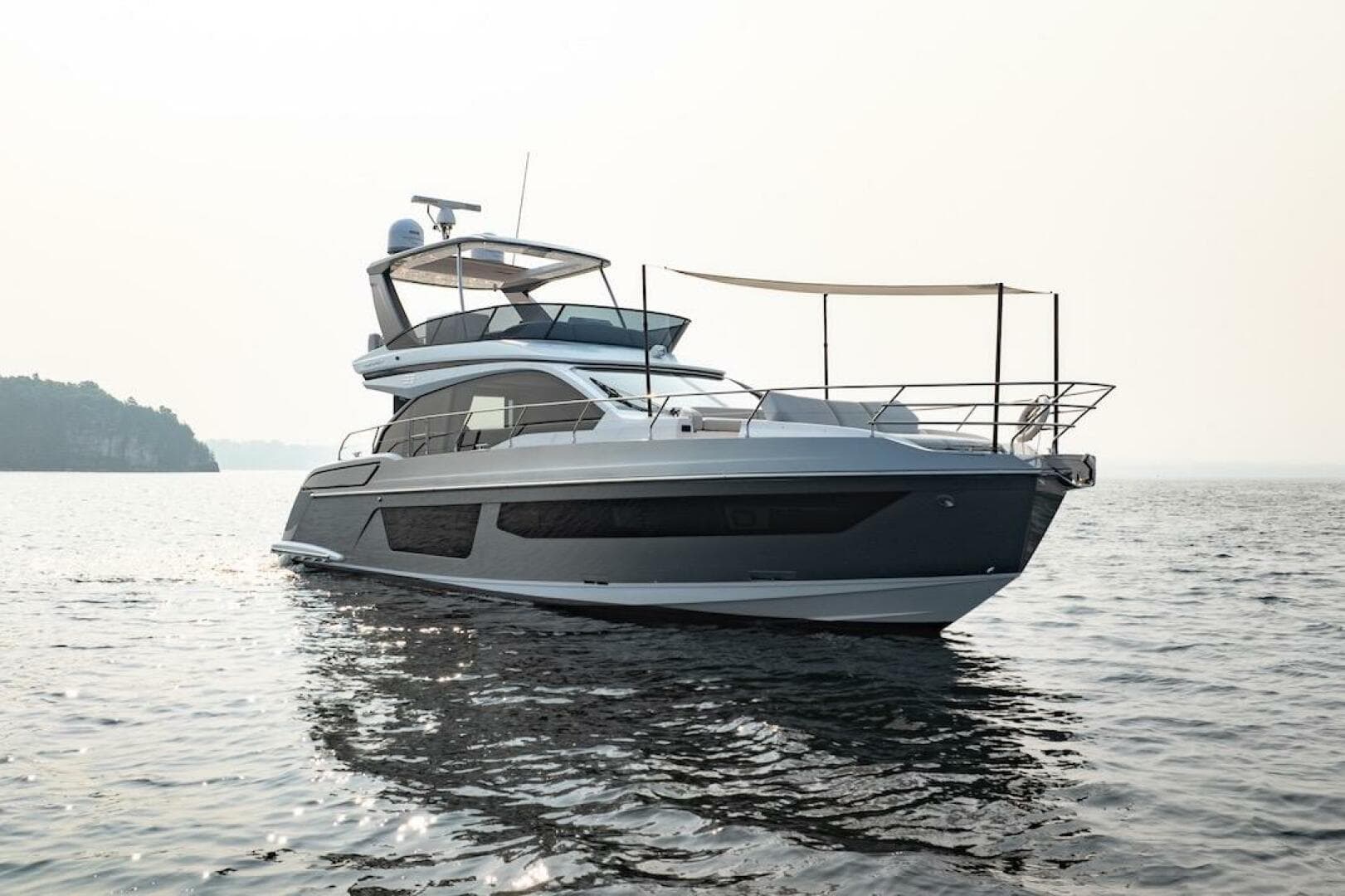 2023 Azimut Fly 53 yacht on calm water, showcasing sleek design and luxury features.