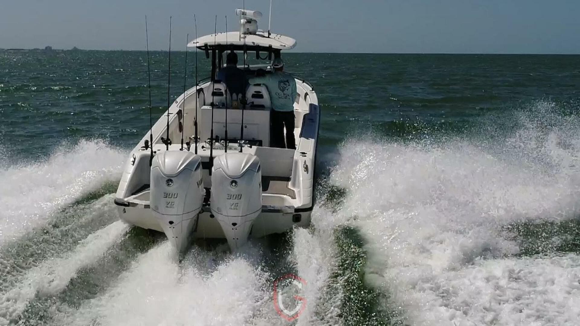 2023 CG Boat Works 35 M-Series cruising on open water, rear view.