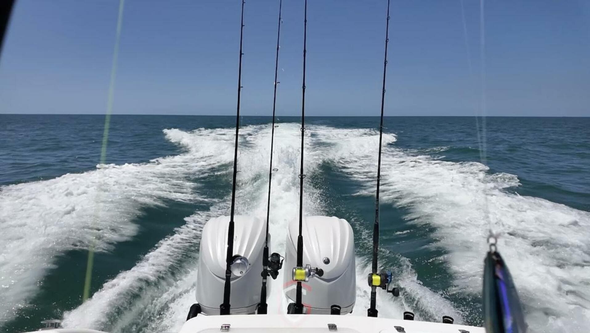 2023 CG Boat Works 35 M-Series cruising on open ocean with fishing rods.