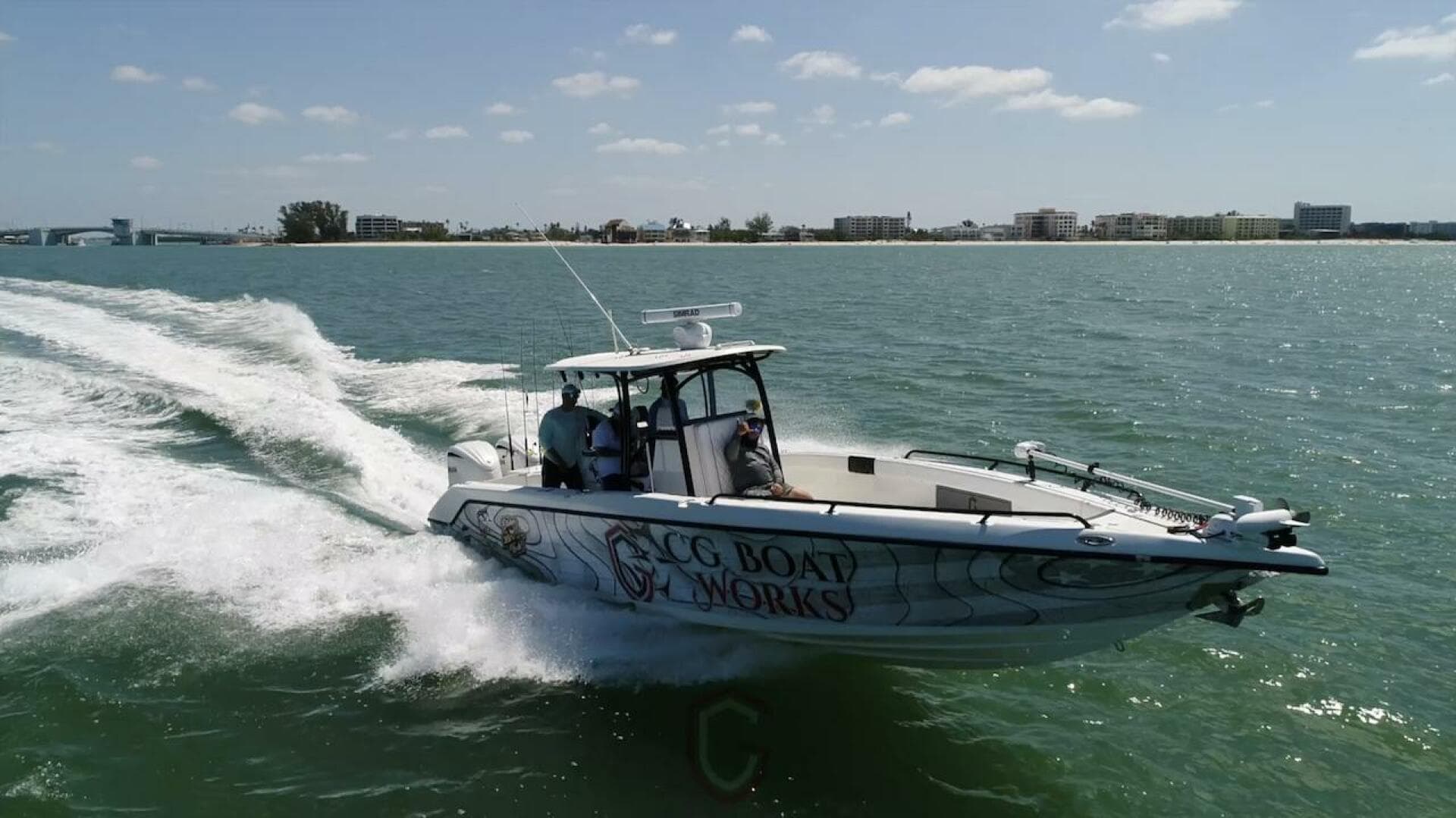 2023 CG Boat Works 35 M-Series cruising on open water near coastline.