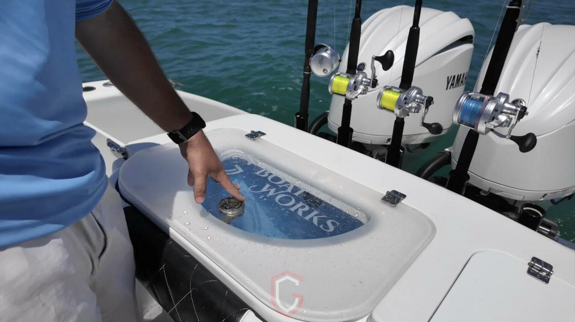 2023 CG Boat Works 35 M-Series with fishing rods and Yamaha engines on water.