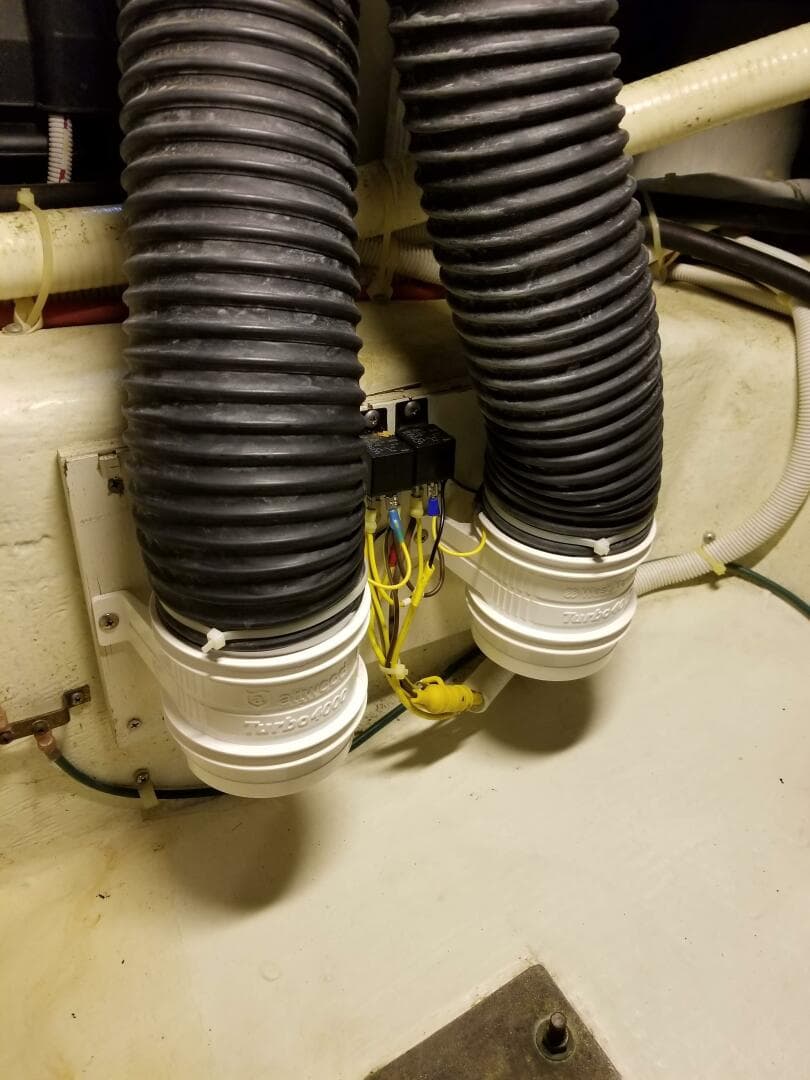 2004 Carver 360 Sport Sedan engine room with ventilation hoses and wiring.