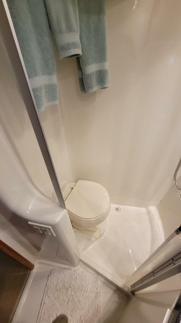 Compact bathroom in 2004 Carver 360 Sport Sedan with shower and toilet.