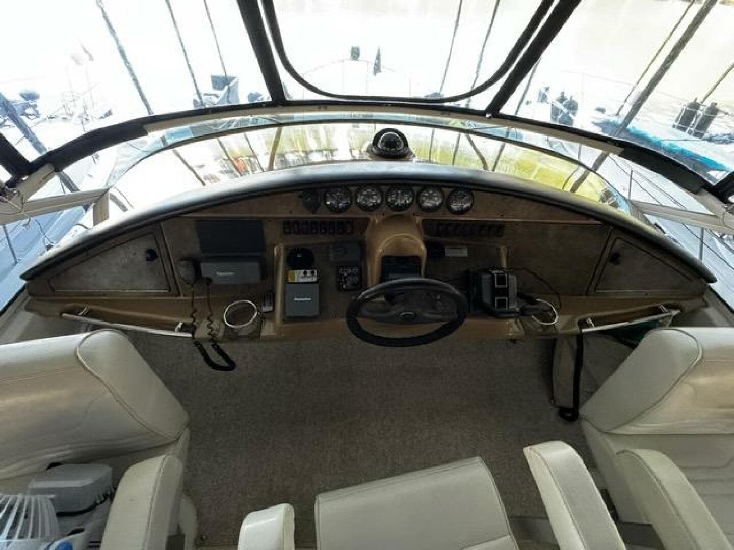 2004 Carver 360 Sport Sedan helm with steering wheel, gauges, and controls.