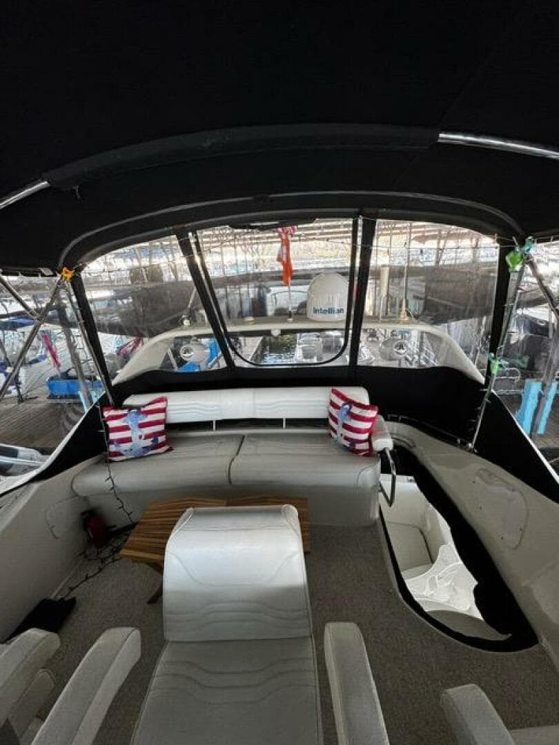 Interior view of 2004 Carver 360 Sport Sedan with seating and striped cushions.