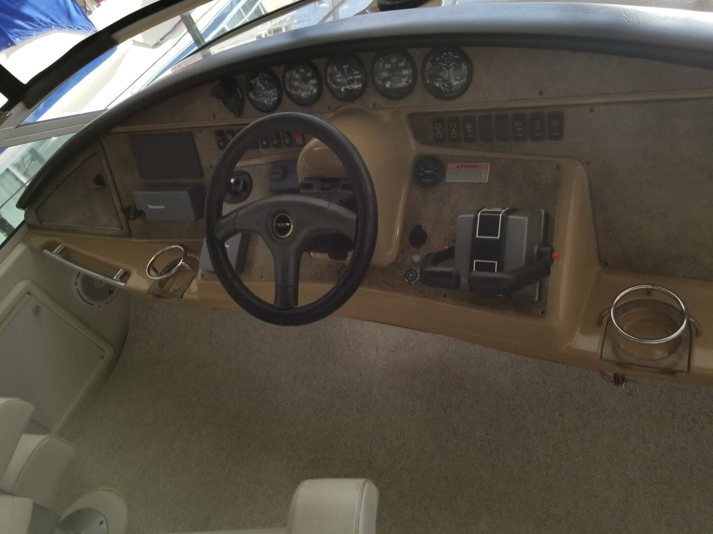 2004 Carver 360 Sport Sedan dashboard with steering wheel and control panel.