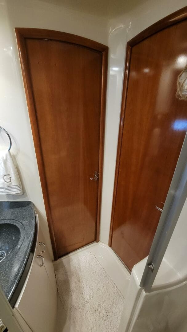 2004 Carver 360 Sport Sedan interior with wooden doors and compact bathroom design.