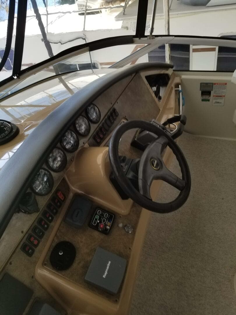 2004 Carver 360 Sport Sedan helm with steering wheel and instrument panel.