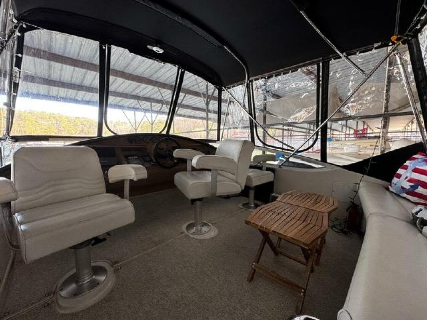 2004 Carver 360 Sport Sedan interior with white seating and wooden table.