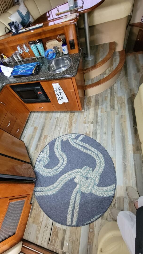 Interior of a 2004 Carver 360 Sport Sedan with wood flooring and nautical-themed decor.