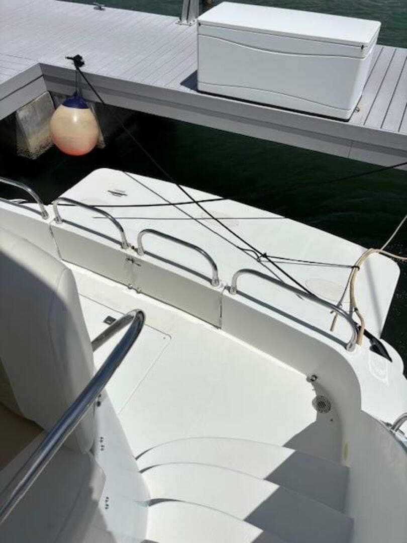 2006 Carver 43 Motor Yacht docked, showing deck and railing details.