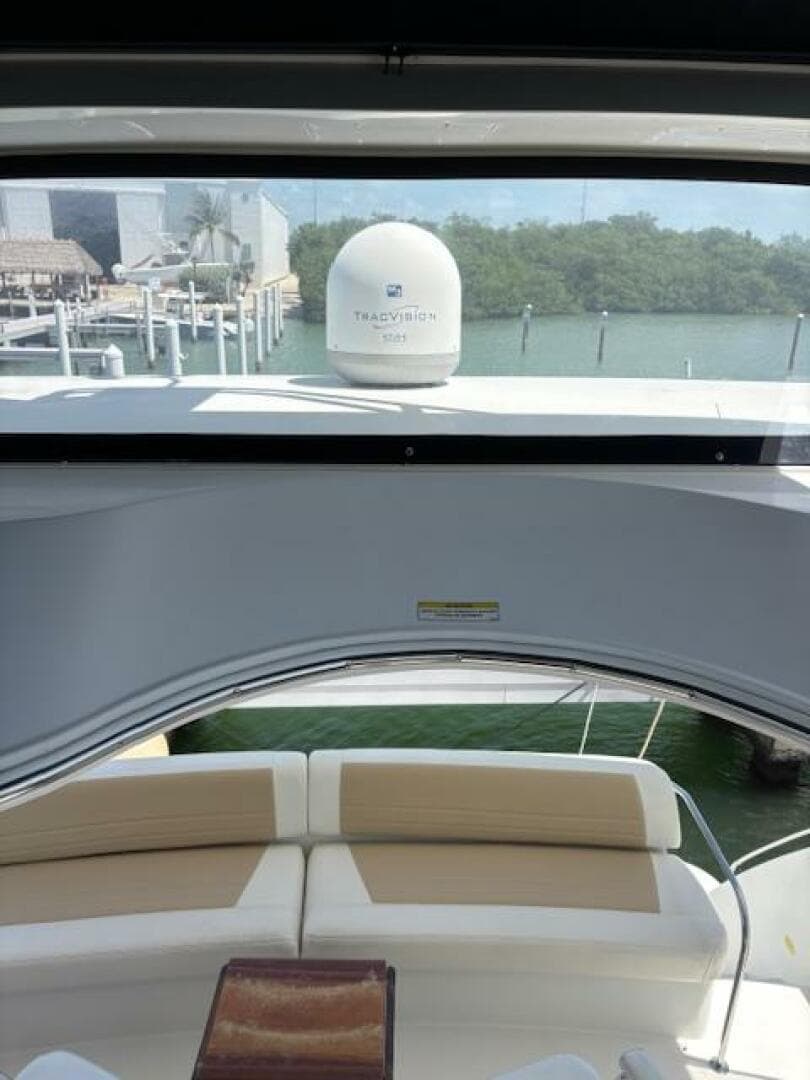 2006 Carver 43 Motor Yacht interior with seating, overlooking marina and water.