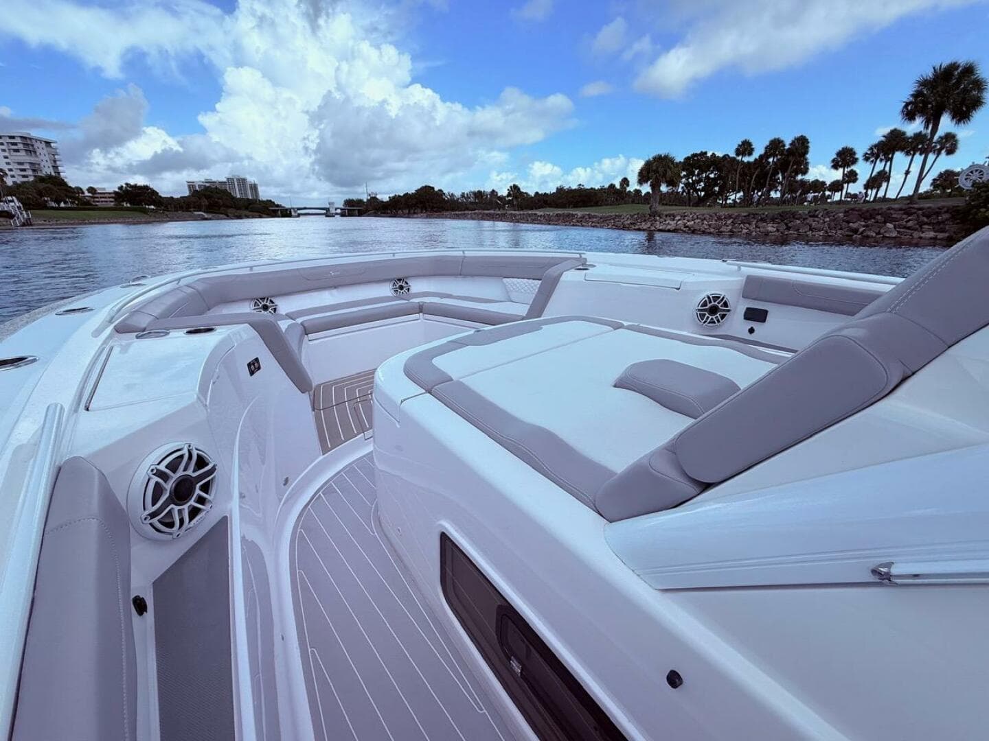 Luxurious 2024 Scout 400 LXF boat interior with plush seating and scenic waterway view.