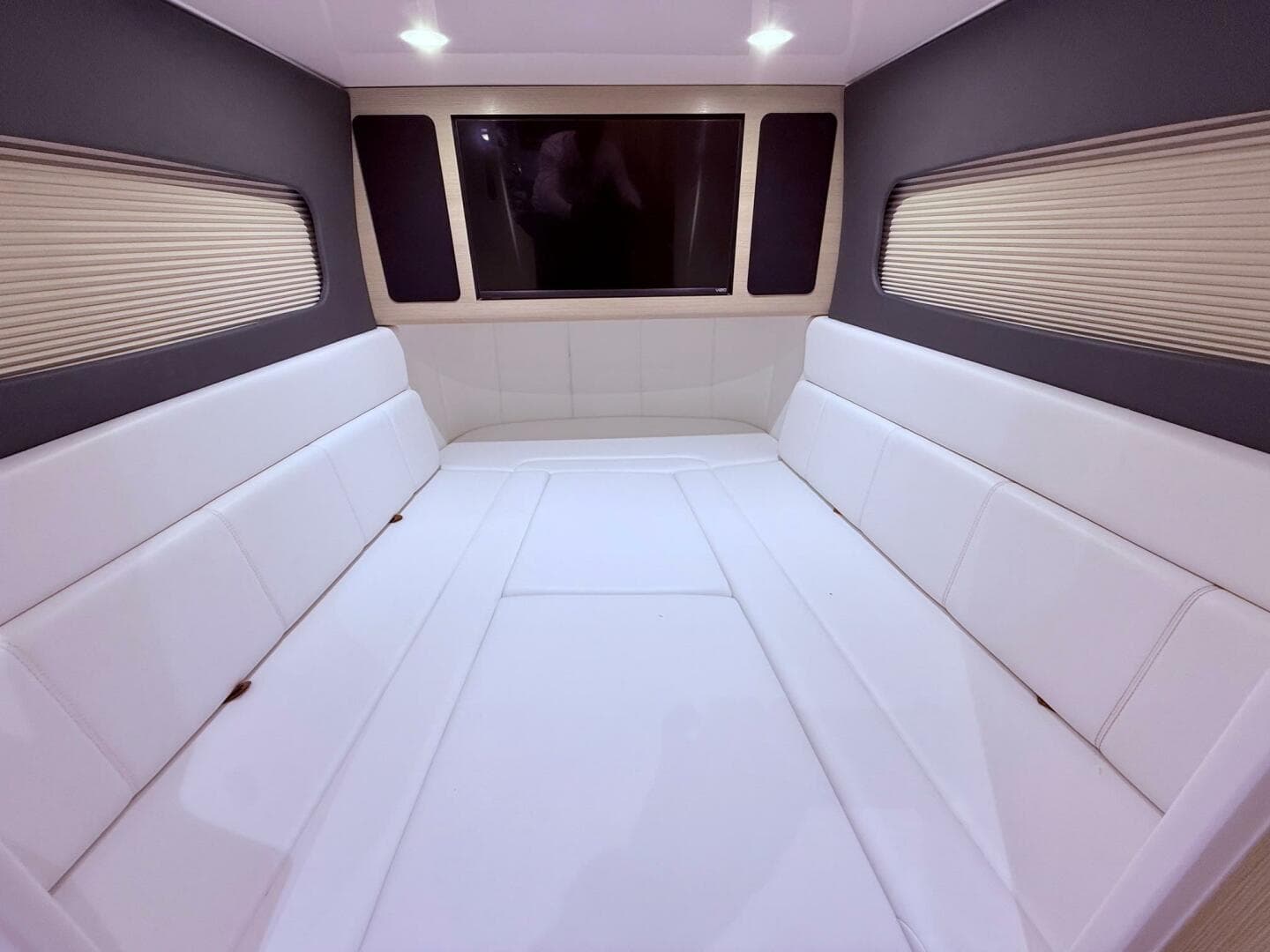 Luxurious interior cabin of 2024 Scout 400 LXF with white seating and modern design.