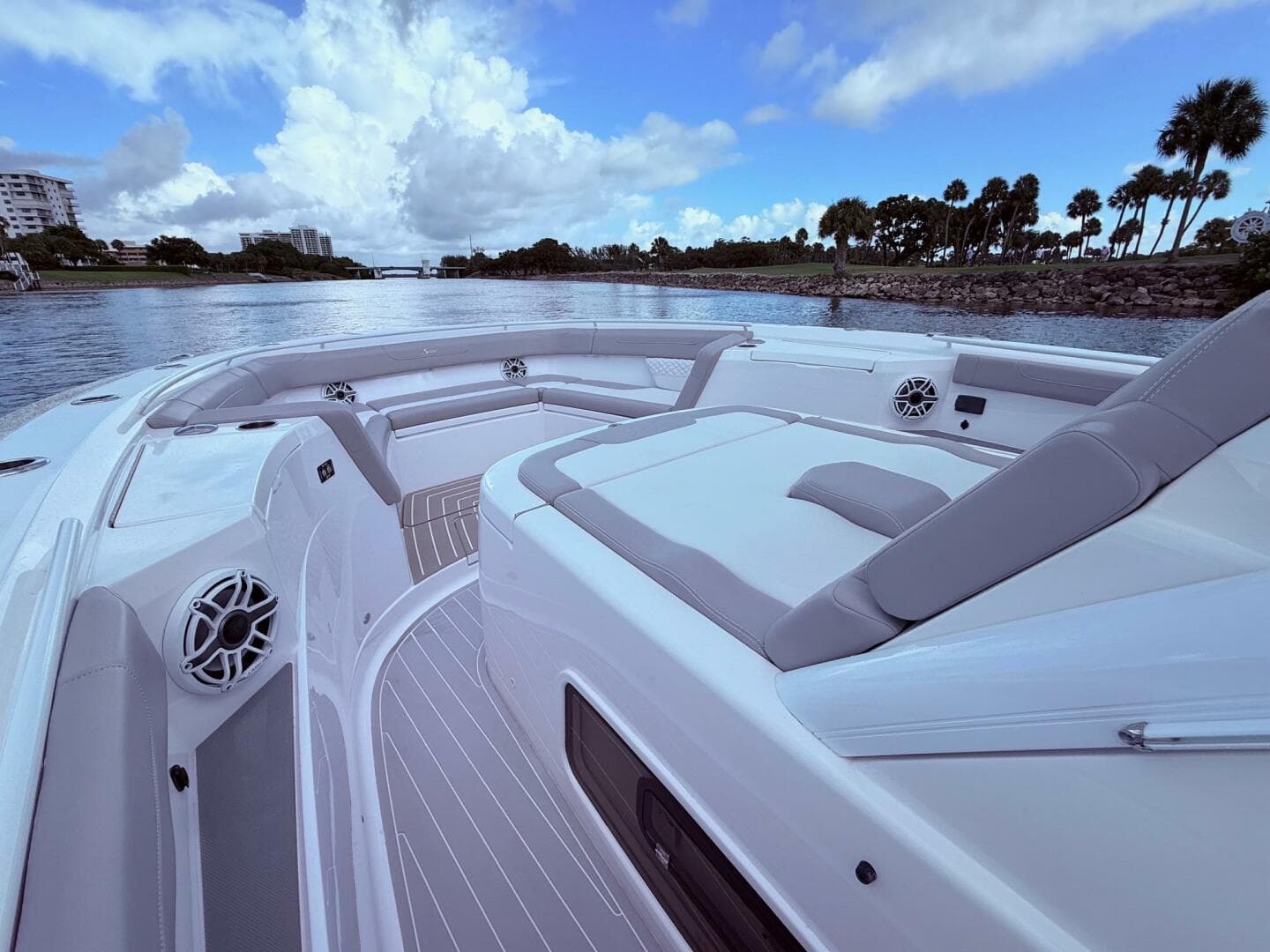 2024 Scout 400 LXF luxury boat interior with plush seating and scenic waterway view.