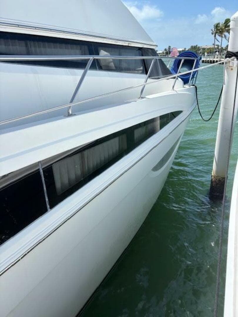 2006 Carver 43 Motor Yacht docked in sunny marina, side view.