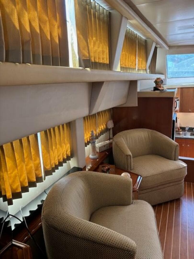 Interior of 2006 Carver 43 Motor Yacht with cozy seating and warm lighting.