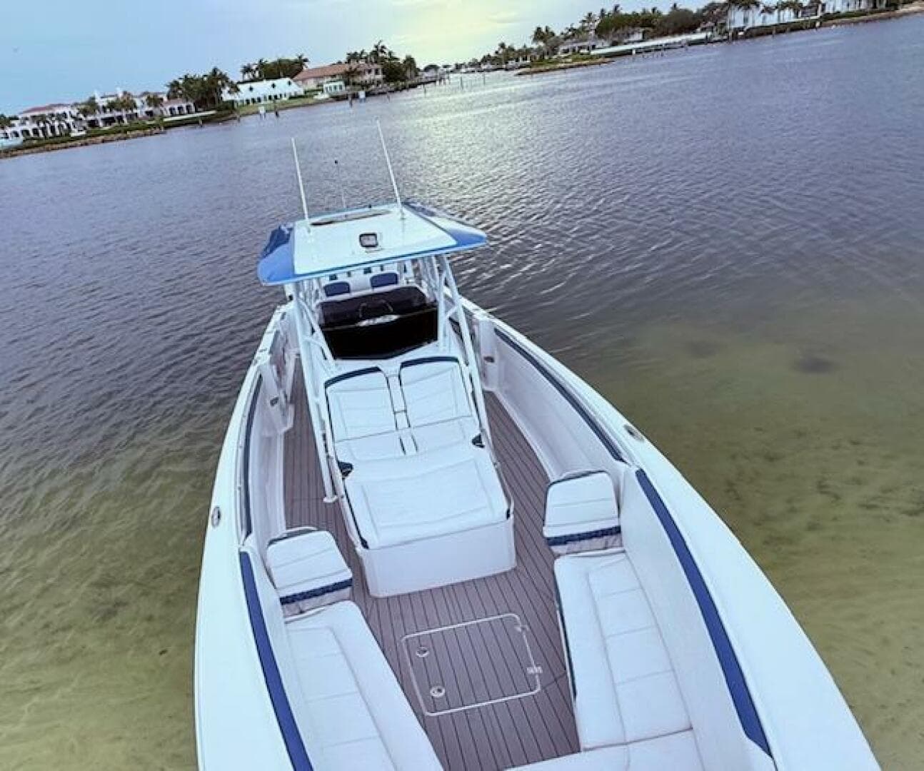 2022 Nor-Tech 390 Sport Center Console boat on calm water, showcasing spacious deck.