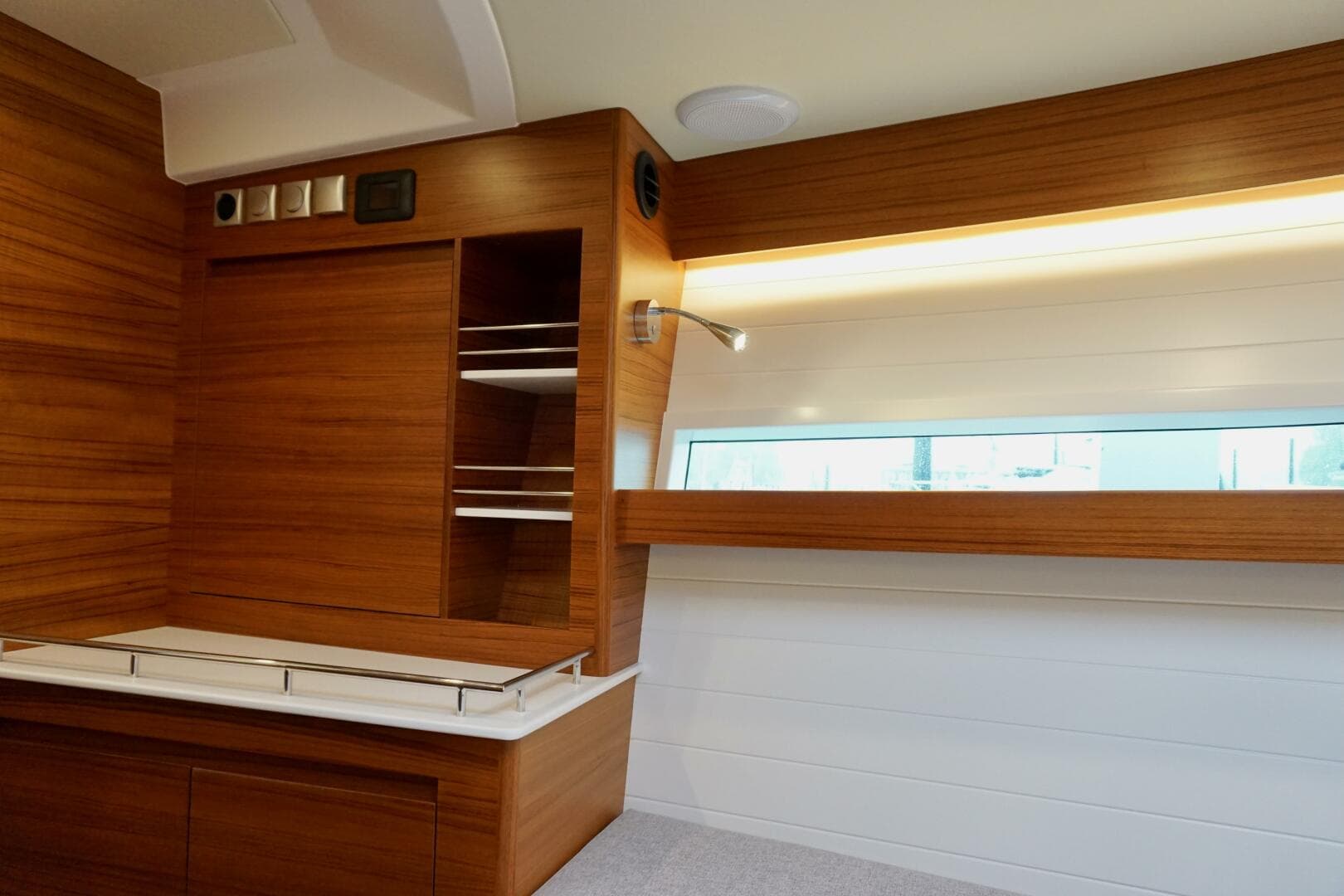 2023 Delta Powerboats 33 Coupe London Calling portside bulkhead storage