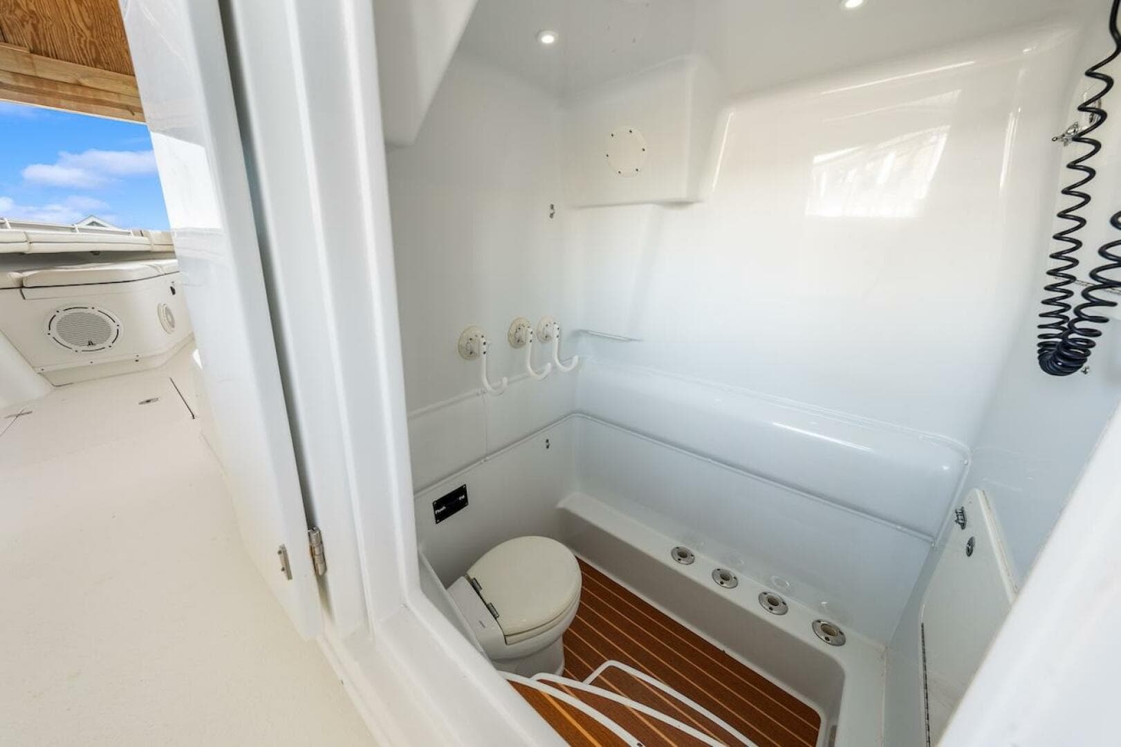 2015 Yellowfin 39 boat interior with white cabin and wooden floor.