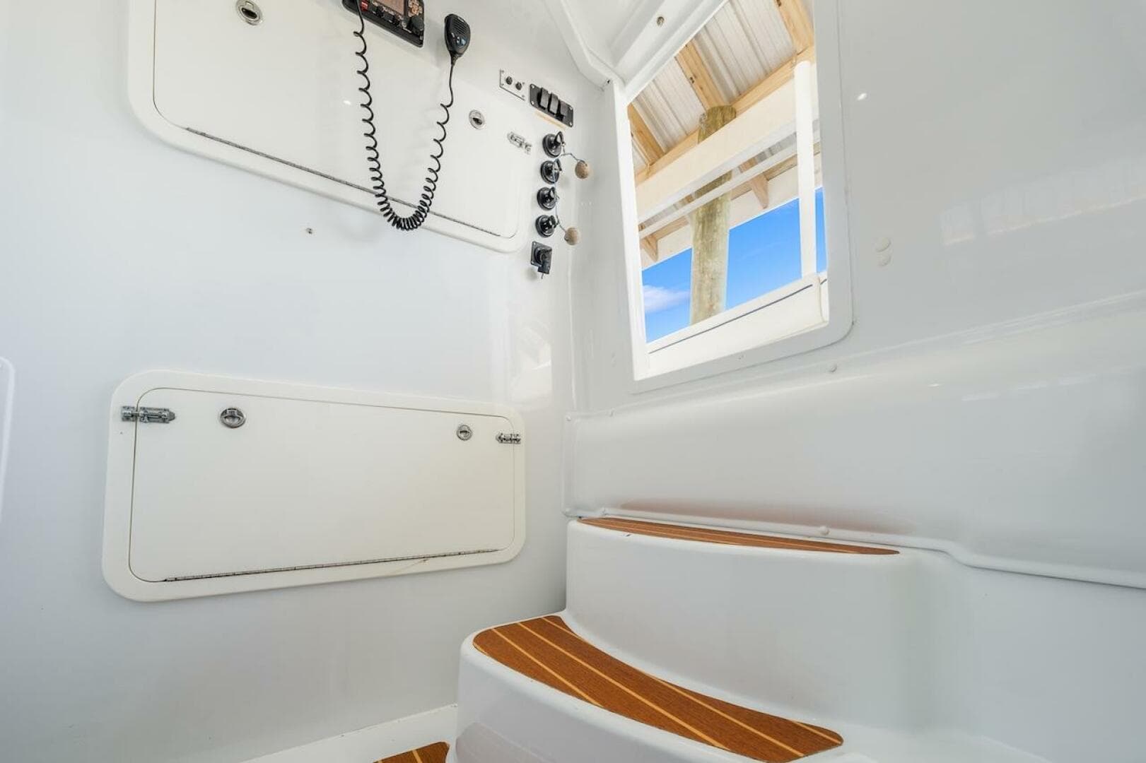 Interior of 2015 Yellowfin 39 boat with steps and control panel.