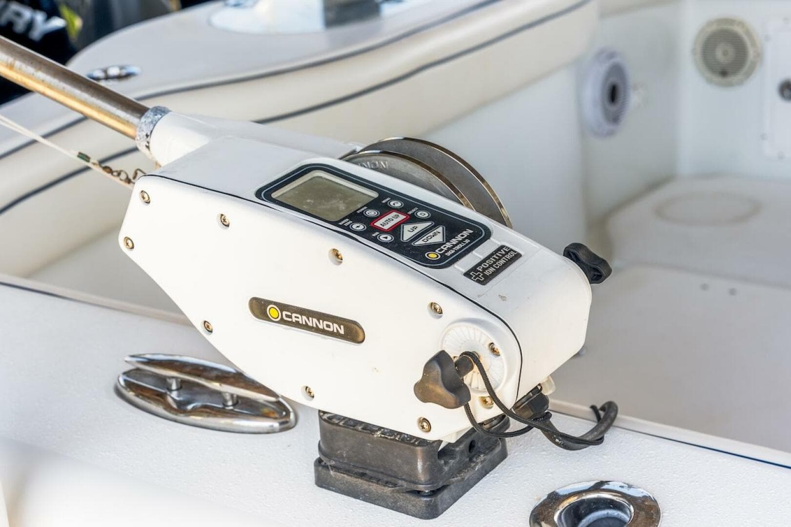 Cannon downrigger on 2015 Yellowfin 39 boat deck, featuring control panel and wiring.