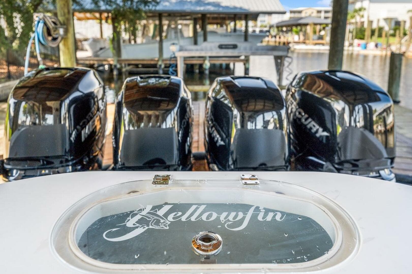 2015 Yellowfin 39 boat with four Mercury outboard engines at a dock.
