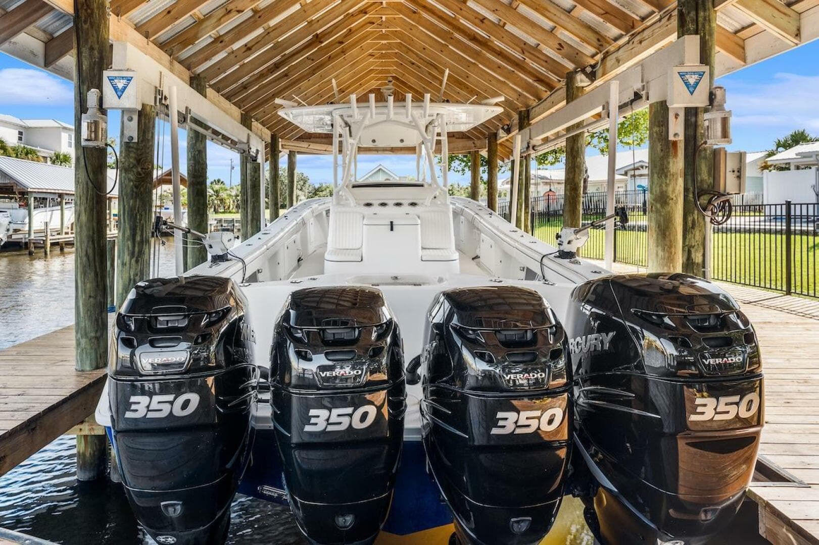 2015 Yellowfin 39 boat with four Mercury 350 engines in a covered dock.