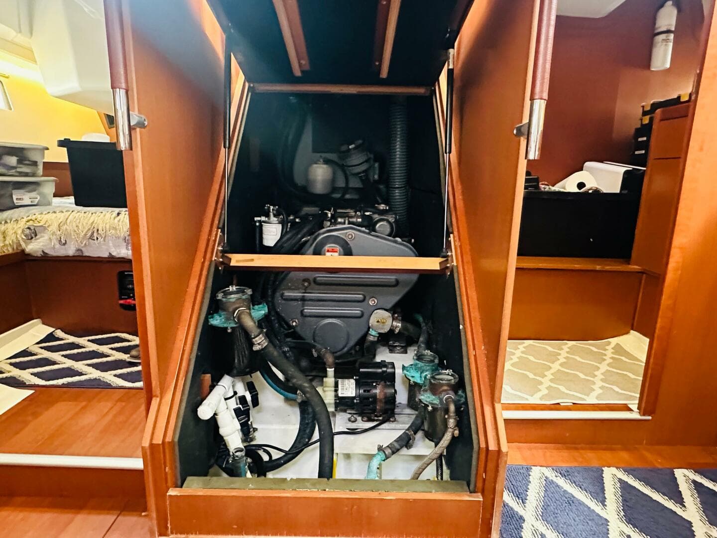 Engine compartment of 2015 Beneteau Oceanis 45 sailboat, showcasing mechanical components.