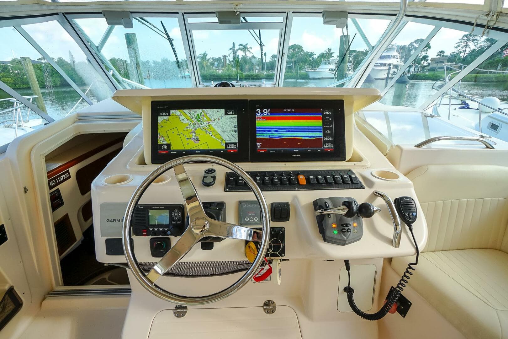 2007 Grady-White Express 360 helm with navigation screens and steering wheel.