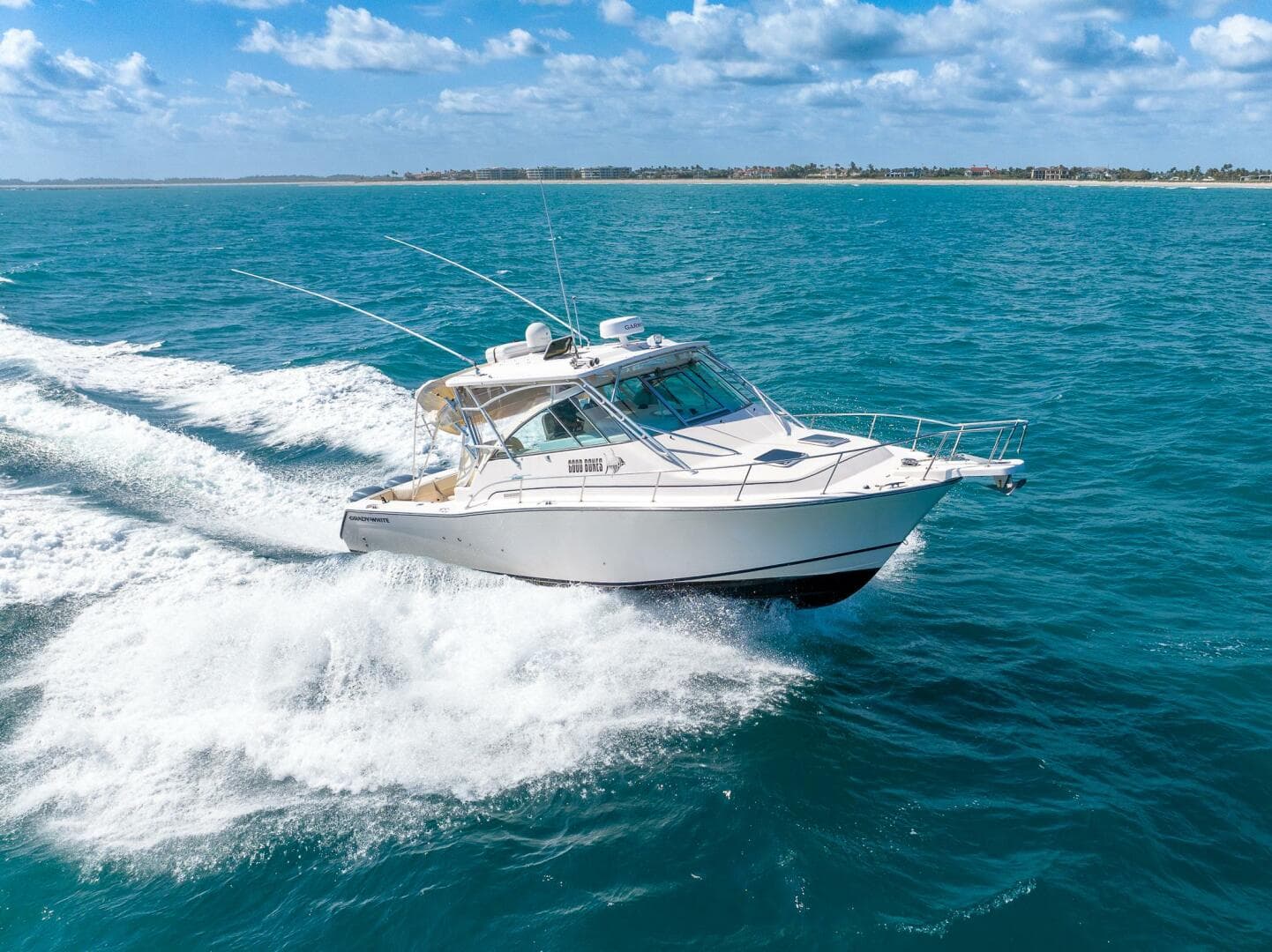 2007 Grady-White Express 360 cruising on open blue waters under a clear sky.
