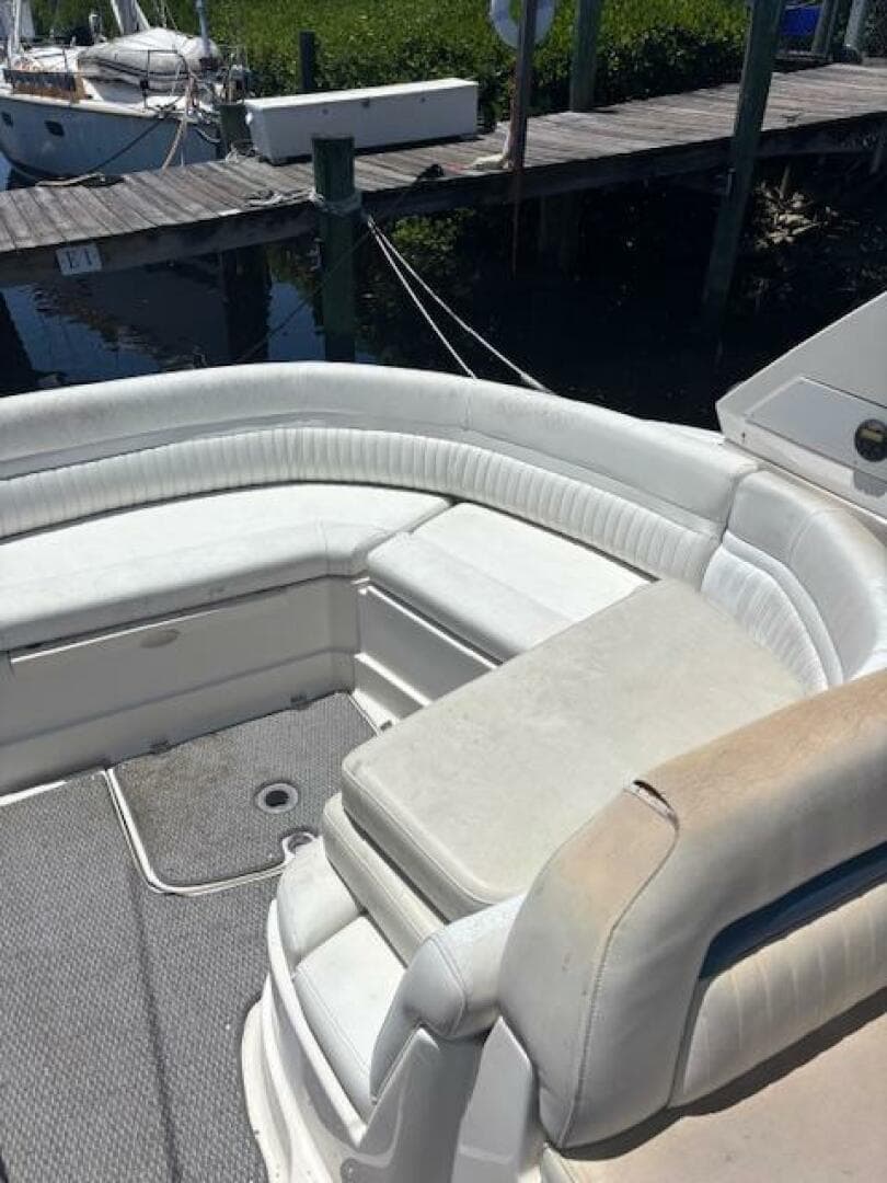 2007 Monterey 350 Sport Yacht interior with white seating and docked at marina.