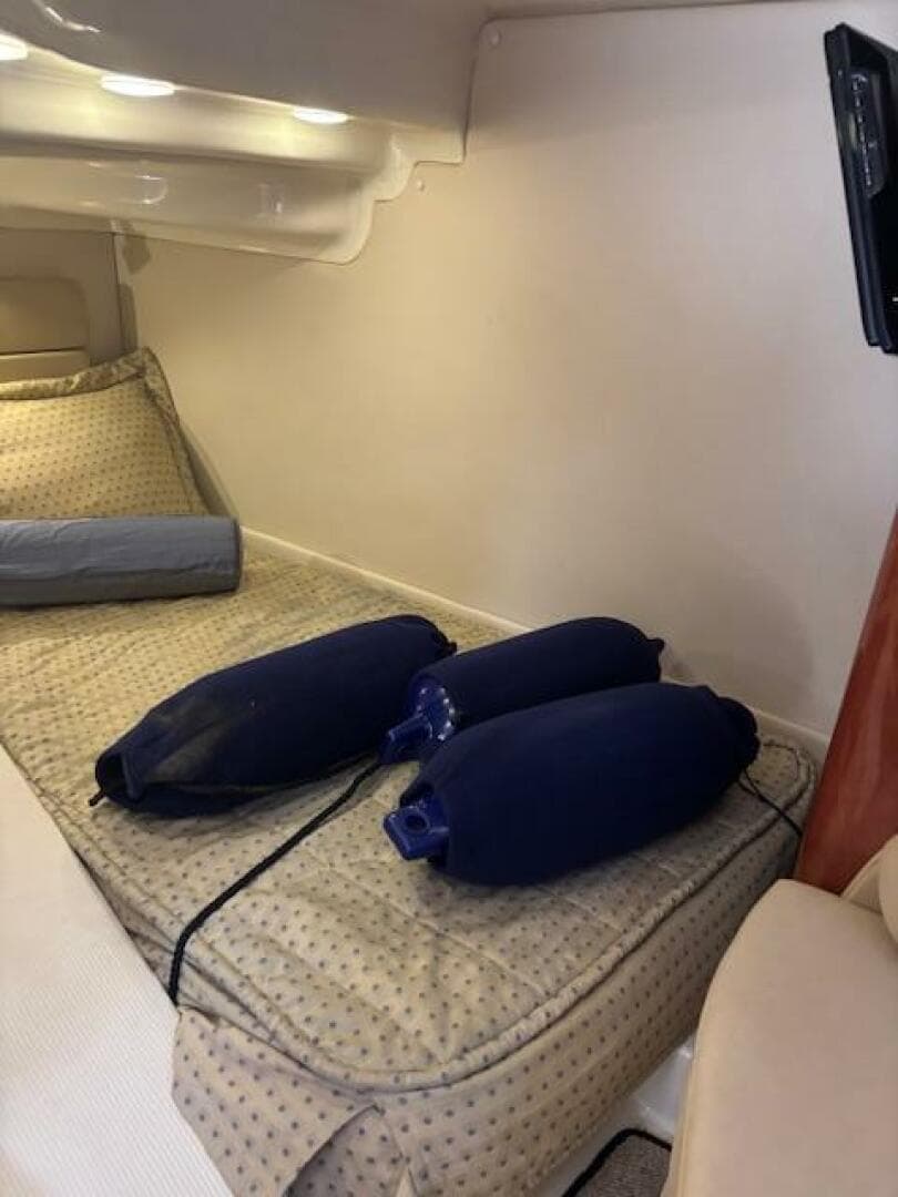 Interior cabin of 2007 Monterey 350 Sport Yacht with cushions and fenders.