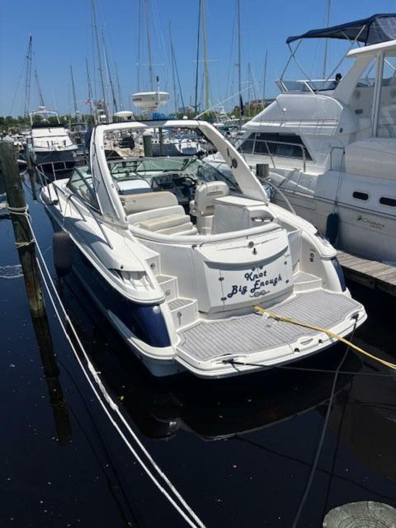 2007 Monterey 350 Sport Yacht docked in marina, surrounded by other boats.