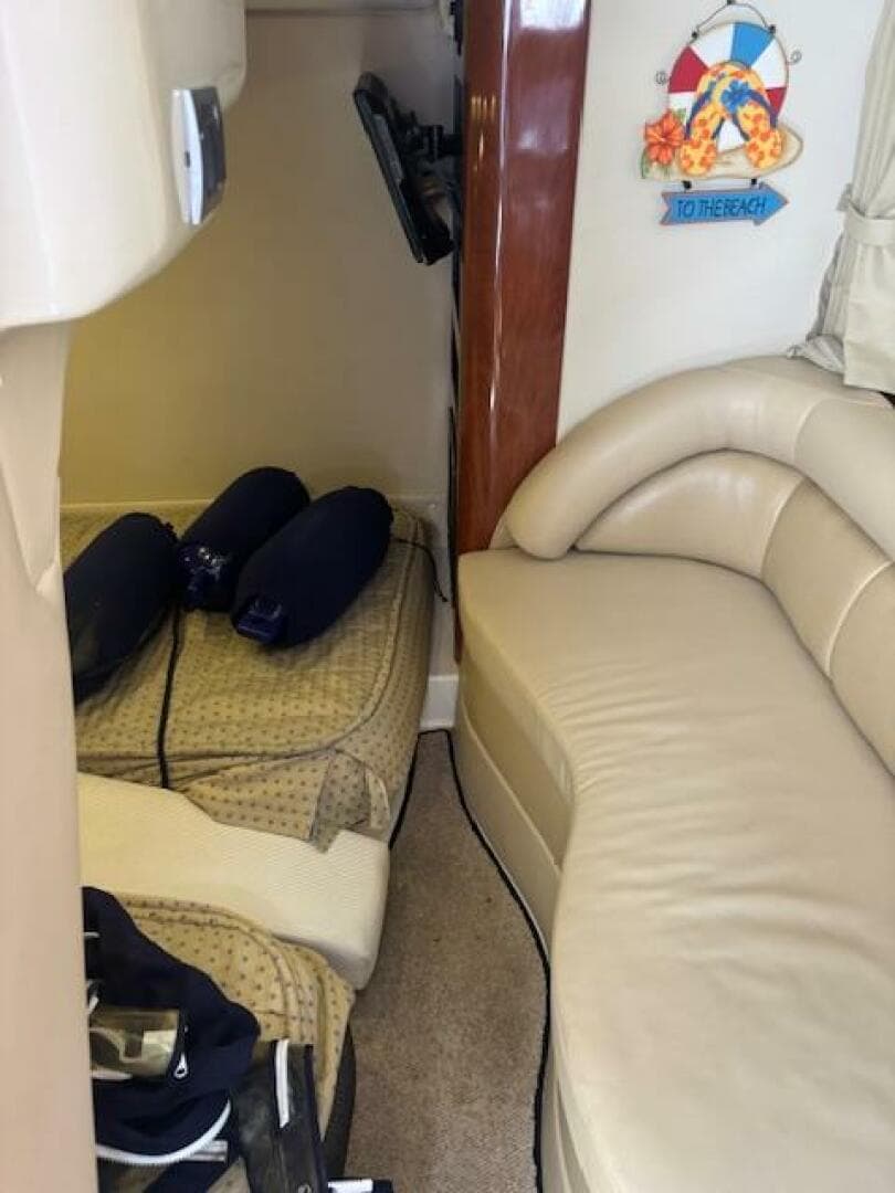 Interior of 2007 Monterey 350 Sport Yacht with beige seating and nautical decor.