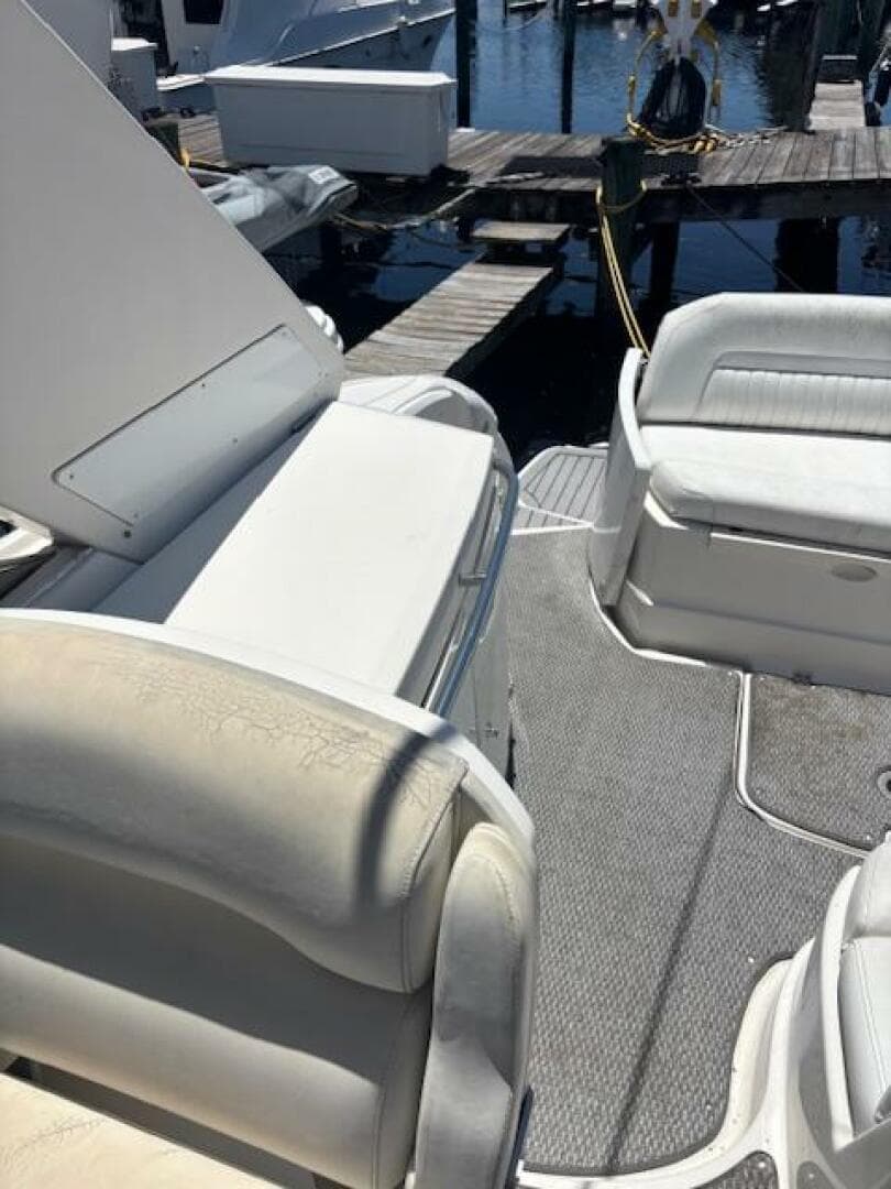 2007 Monterey 350 Sport Yacht interior with white seating and dock view.