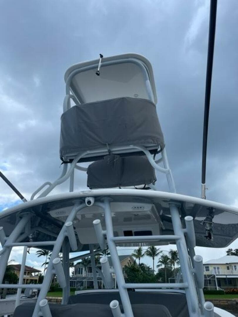 2018 Regulator 41 boat with tower against cloudy sky backdrop.