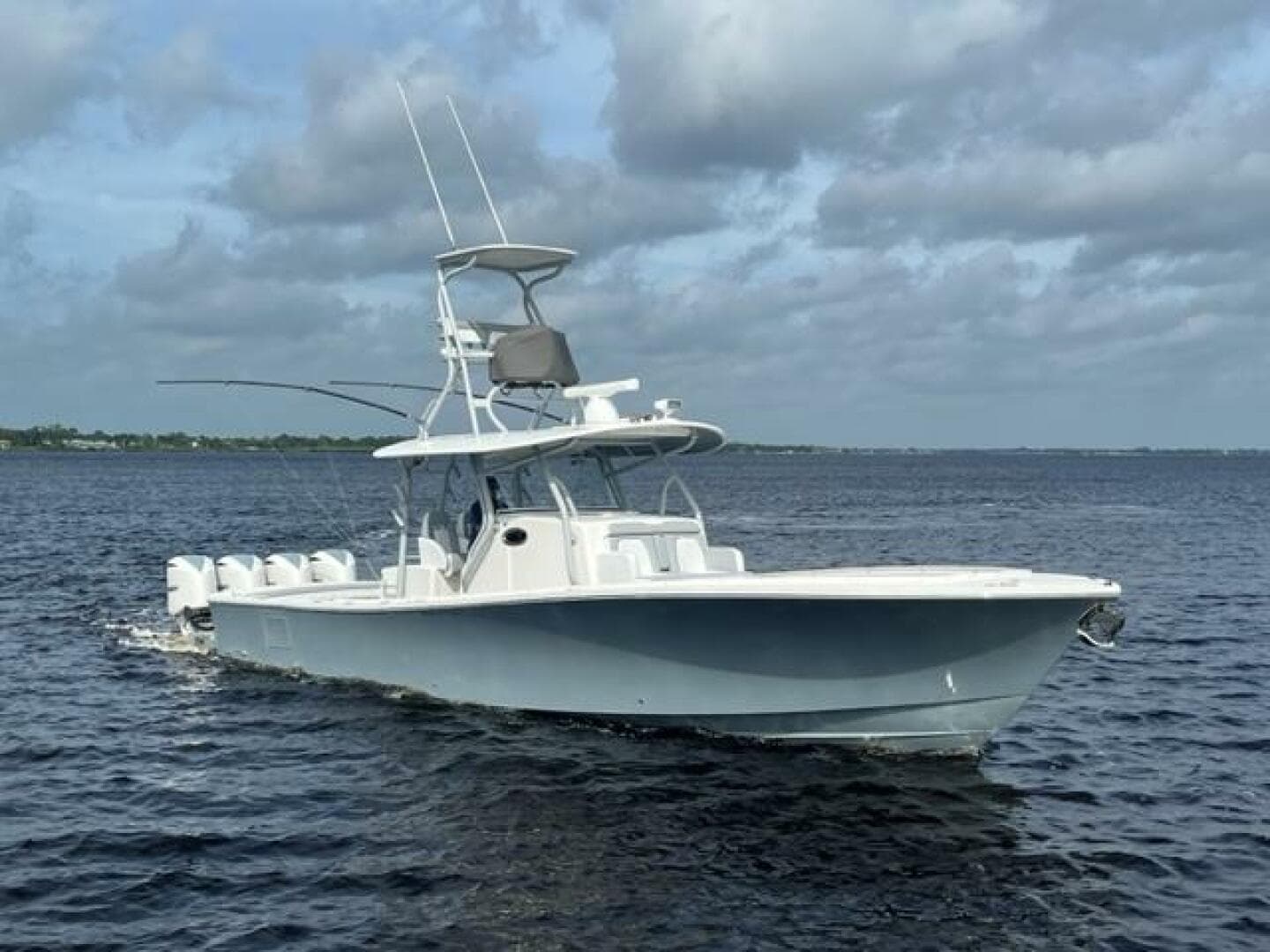 2018 Regulator 41 boat cruising on open water under cloudy skies.