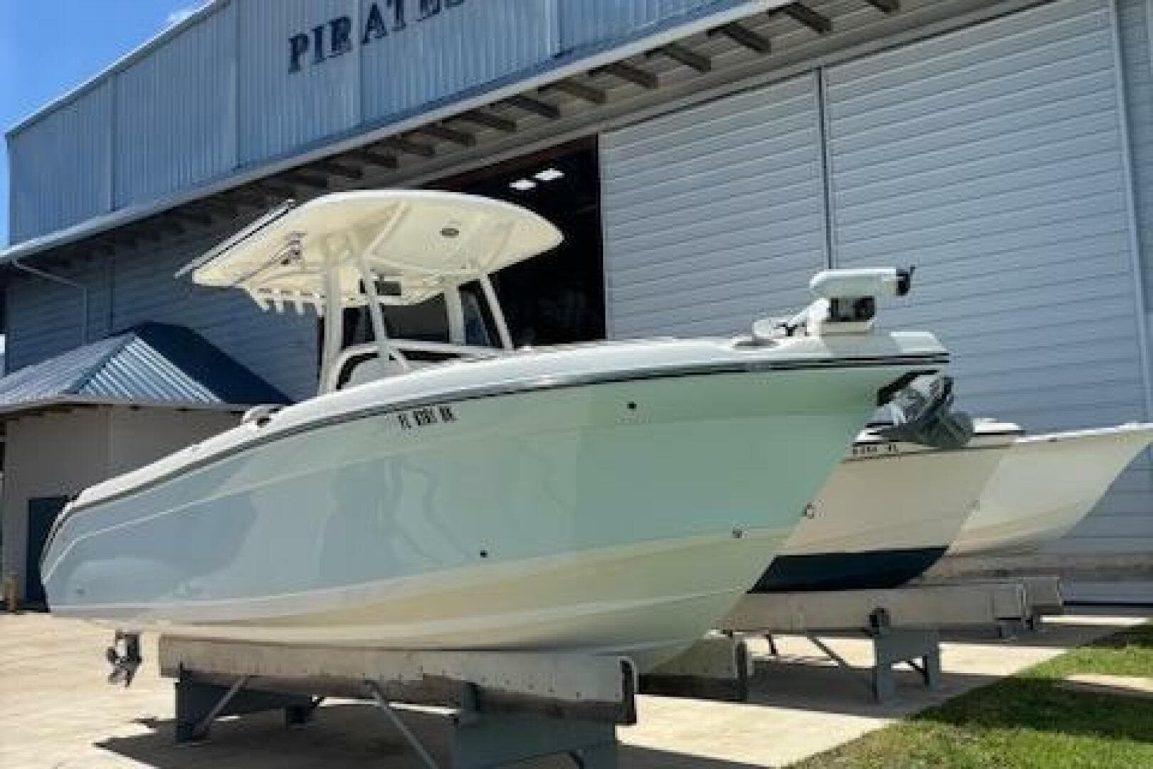 2018 Century 2600 Center Console boat on display outside a large warehouse.