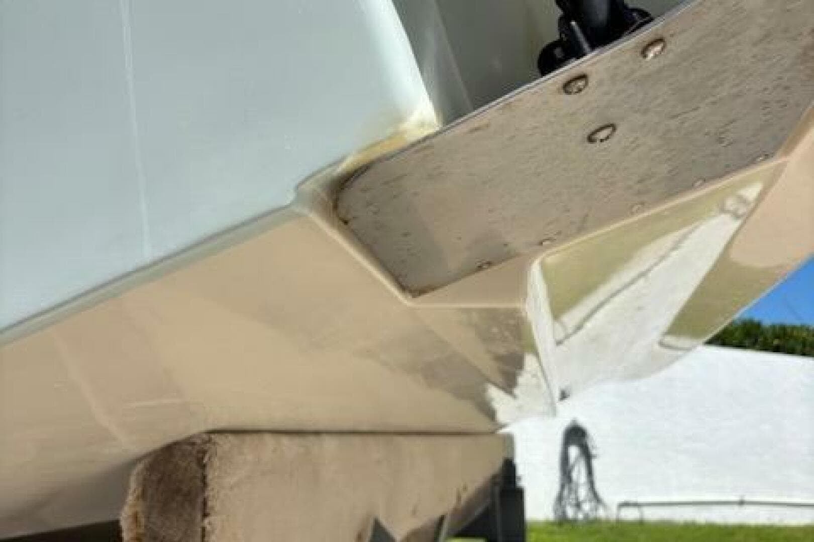 2018 Century 2600 Center Console boat hull detail, showing underside and metal fittings.